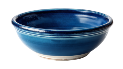 Vibrant blue ceramic bowl showcasing smooth glaze and elegant curves, perfect for serving or decorative purposes in any kitchen or dining setting. on a transparent background