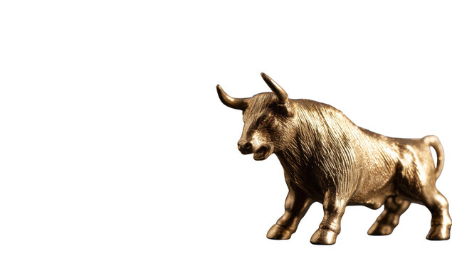 Golden bull statue against black background
