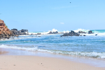 waves-crashing-on-shore-rocks