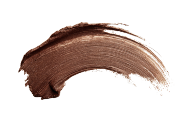 Smudged, light brown cosmetic smear on black background