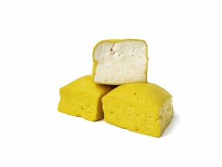 Three fresh tofu or Indonesian food made from coagulated soybean sediment. Isolated on white background 