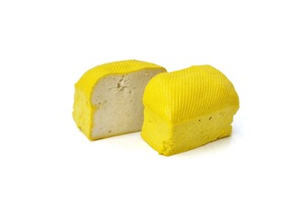 Fresh tofu slices or Indonesian food made from coagulated soybean sediment. Isolated on white background 