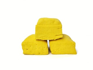 Three fresh tofu or Indonesian food made from coagulated soybean sediment. Isolated on white background 