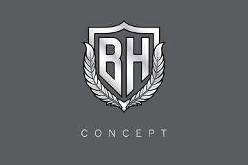 BH Creative Initial Letter Logo with Shield and Laurel Wreath Silver Metallic Branding Emblem on Gray Background.