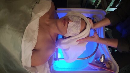 Beauty spa therapy with blue light relaxation. 4K video.