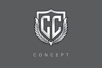 CC Creative Initial Letter Logo with Shield and Laurel Wreath Silver Metallic Branding Emblem on Gray Background.