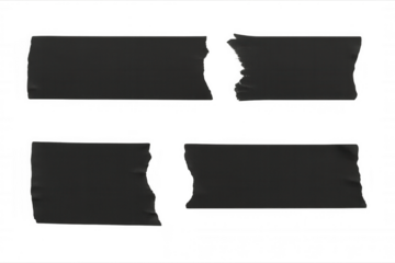 Black adhesive tape strips with ragged edges lying on clear surface, showcasing realistic graphic design texture and element