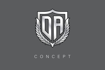 DA Creative Initial Letter Logo with Shield and Laurel Wreath Silver Metallic Branding Emblem on Gray Background.