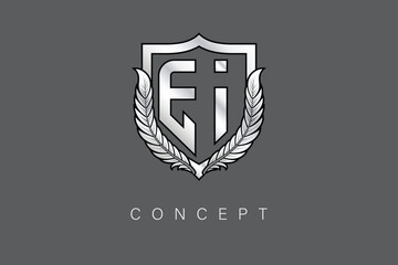 EI Creative Initial Letter Logo with Shield and Laurel Wreath Silver Metallic Branding Emblem on Gray Background.