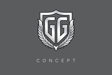 GG Creative Initial Letter Logo with Shield and Laurel Wreath Silver Metallic Branding Emblem on Gray Background.