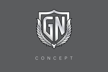 GN Creative Initial Letter Logo with Shield and Laurel Wreath Silver Metallic Branding Emblem on Gray Background.