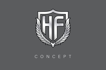 HF Creative Initial Letter Logo with Shield and Laurel Wreath Silver Metallic Branding Emblem on Gray Background.