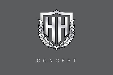 HH Creative Initial Letter Logo with Shield and Laurel Wreath Silver Metallic Branding Emblem on Gray Background.