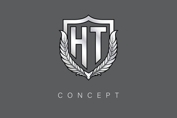 HT Creative Initial Letter Logo with Shield and Laurel Wreath Silver Metallic Branding Emblem on Gray Background.
