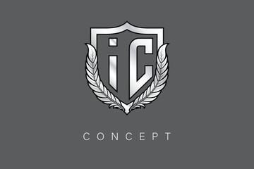 IC Creative Initial Letter Logo with Shield and Laurel Wreath Silver Metallic Branding Emblem on Gray Background.