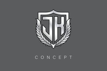JK Creative Initial Letter Logo with Shield and Laurel Wreath Silver Metallic Branding Emblem on Gray Background.