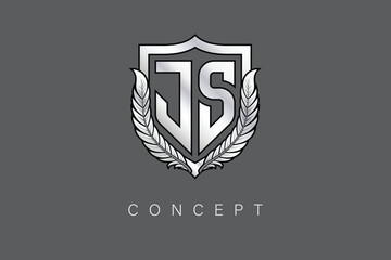 JS Creative Initial Letter Logo with Shield and Laurel Wreath Silver Metallic Branding Emblem on Gray Background.