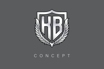KB Creative Initial Letter Logo with Shield and Laurel Wreath Silver Metallic Branding Emblem on Gray Background.