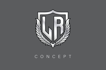 LR Creative Initial Letter Logo with Shield and Laurel Wreath Silver Metallic Branding Emblem on Gray Background.