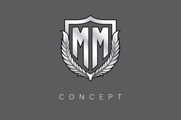 MM Creative Initial Letter Logo with Shield and Laurel Wreath Silver Metallic Branding Emblem on Gray Background.