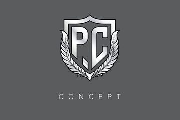PC Creative Initial Letter Logo with Shield and Laurel Wreath Silver Metallic Branding Emblem on Gray Background.