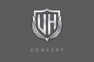 UH Creative Initial Letter Logo with Shield and Laurel Wreath Silver Metallic Branding Emblem on Gray Background.