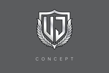 UJ Creative Initial Letter Logo with Shield and Laurel Wreath Silver Metallic Branding Emblem on Gray Background.