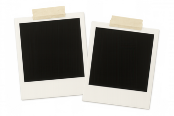 Pair of blank instant photo prints affixed to a clear surface using adhesive tape, offering a customizable and retro-inspired setting