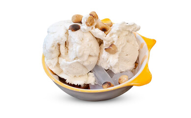 Traditional Thai coconut milk ice cream served in a cute bowl, topped with roasted peanuts and jelly, on white background