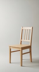 Simple wooden chair on a neutral backdrop showcasing minimalist design and craftsmanship