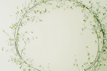 Delicate floral wreath artfully arranged in a soft, pale green circle, featuring small white flowers and verdant foliage, creating a serene and tranquil aesthetic.
