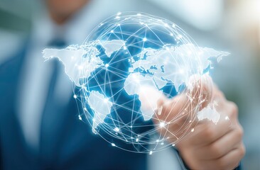 A person's finger hovers over a digital world map, connected by a network of lines