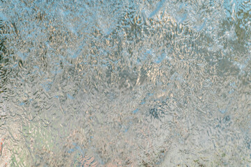 Aqua background. Product space next to clean water streams and water splashes and drops.