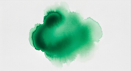 A green ink blot on a white background creating an abstract watercolor painting effect with soft edges
