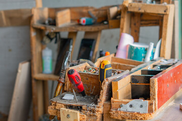 Workbench with hand tools in a woodworking workshop