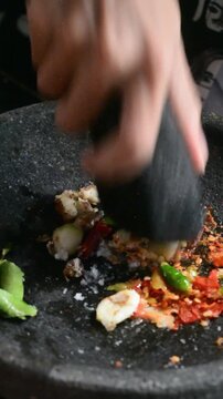 Grinding Traditional Cooking Spices Using Mortar and Pestle