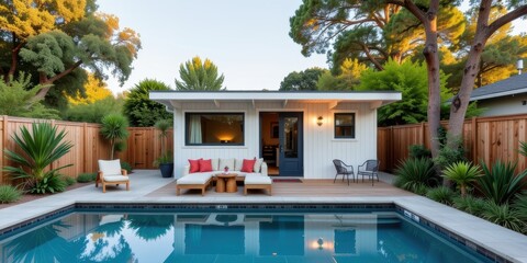Accessory dwelling unit. Modern poolside house with a cozy deck and lush greenery surrounding it.