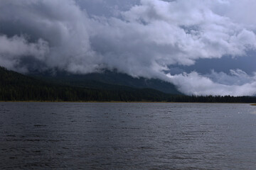 A Mysterious Lake Located Beneath Dark and Ominous Clouds