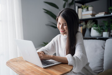 Fototapeta premium Asian Businesswoman VDO Call Conference Work &nbsp;talk chat online video call on laptop webcam conference working with laptop online briefing E learning and social distancing concept