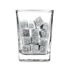 Monochrome sugar cubes in a clear glass against a black background studio shot