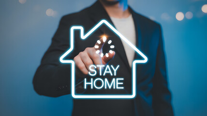 Stay home concept with man touching virtual house hologram safety