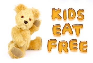 Soft toy bear with kids eat free text made from potato alphabet shapes