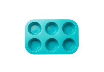 Teal colored silicone muffin tin, six small round cavities, sits on a plain black background.