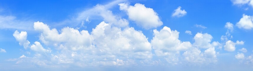 White cumulus clouds on clear blue sky background panorama, beautiful cloudy skies panoramic view, fluffy cloud texture, cloudscape backdrop, sunny summer day heaven landscape, cloudiness, copy space