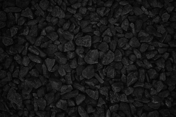 Natural pebble rock pattern for background, black and grey gravel stone texture.