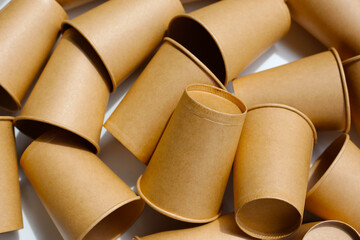 Brown paper cups on white background.