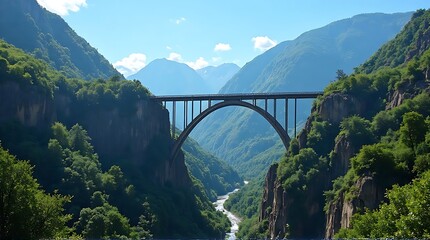 Obraz premium Scenic View of a Concrete Arch Bridge in a Deep Green Canyon