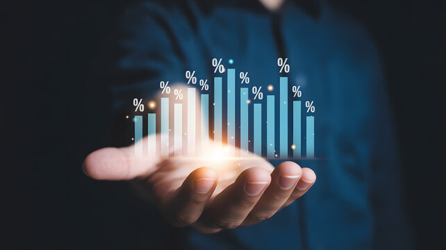 Businessman holding glowing growth chart with percentage symbols in hand