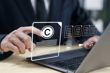 Copyright protect idea concept, rights protection, invention patent, author rights and patent intellectual property. Businessman manage copyright documents on laptop.