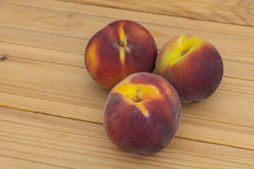 Fresh Ripe Peaches on Wooden Table Closeup